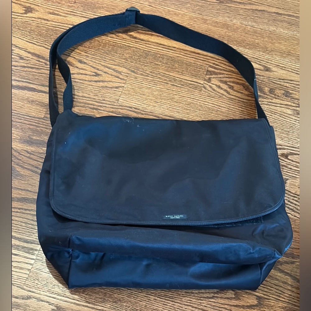 Black Messenger Bag used as diaper bag with diaper pad and many compartments